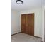Carpeted bedroom with double door closet at 4288 Silver Hill Dr, Greenwood, IN 46142