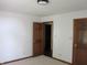 A basic bedroom with two doors leading to other rooms at 4288 Silver Hill Dr, Greenwood, IN 46142