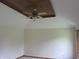 Bedroom featuring tray ceiling, ceiling fan, and neutral walls, offering a bright and airy space at 4288 Silver Hill Dr, Greenwood, IN 46142