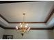 Tray ceiling with a decorative chandelier adds elegance and charm to the space at 4288 Silver Hill Dr, Greenwood, IN 46142