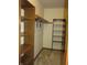 A walk-in closet with wood shelves and neutral carpet and walls at 4288 Silver Hill Dr, Greenwood, IN 46142