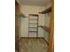 A walk-in closet with wire shelving and neutral carpet and walls at 4288 Silver Hill Dr, Greenwood, IN 46142