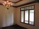 Bright dining room features a chandelier and a large window for lots of natural light at 4288 Silver Hill Dr, Greenwood, IN 46142