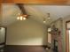 Spacious living room with vaulted ceilings, exposed beams, and a cozy brick fireplace at 4288 Silver Hill Dr, Greenwood, IN 46142