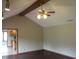 Open living room layout with vaulted ceilings, ceiling fan, and hardwood flooring at 4288 Silver Hill Dr, Greenwood, IN 46142