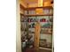 A walk-in pantry with full wooden shelves at 4288 Silver Hill Dr, Greenwood, IN 46142
