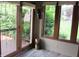 Bright sunroom with floor to ceiling windows, wood trim and a view of the green yard at 4288 Silver Hill Dr, Greenwood, IN 46142