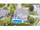 Bird's eye view of a meticulously maintained home and pool area, surrounded by trees and a well-kept neighborhood at 434 Sheffield Ct, Carmel, IN 46032