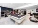 Basement area with a pool table, bar, and lounge area that has unique mural, perfect for entertaining guests at 434 Sheffield Ct, Carmel, IN 46032
