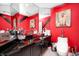 Modern bathroom with unique red accents and a vessel sink atop a black vanity at 434 Sheffield Ct, Carmel, IN 46032