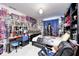 Spacious bedroom filled with trophies and medals, with a full bed and comfortable black leather chair at 434 Sheffield Ct, Carmel, IN 46032