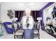 Elegant dining room featuring artistic decor, a glass table, and seating for eight guests at 434 Sheffield Ct, Carmel, IN 46032