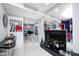 Bright hallway with marble floors, modern artwork, and a fireplace with glass accents at 434 Sheffield Ct, Carmel, IN 46032