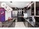 Stylish kitchen with stainless appliances, granite countertops, and modern lighting at 434 Sheffield Ct, Carmel, IN 46032