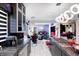 Open-concept kitchen featuring granite countertops, modern appliances, and elegant lighting at 434 Sheffield Ct, Carmel, IN 46032