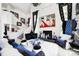 Stylish living room with fireplace, staircase, and bright decor with artistic accents at 434 Sheffield Ct, Carmel, IN 46032