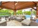 Beautiful outdoor pavilion featuring comfortable seating and serene pool views, ideal for relaxation at 434 Sheffield Ct, Carmel, IN 46032