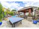 Inviting outdoor pavilion, pool, and ping pong table creating the ultimate backyard retreat at 434 Sheffield Ct, Carmel, IN 46032