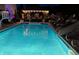 Backyard pool featuring lounge chairs, slide, and well-maintained landscaping at 434 Sheffield Ct, Carmel, IN 46032