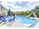 Lovely pool with a slide, seating, and an outdoor pavilion, creating a perfect backyard oasis at 434 Sheffield Ct, Carmel, IN 46032