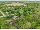 An aerial view of the property reveals mature trees and a spacious lot at 470 Mill Farm Rd, Noblesville, IN 46062