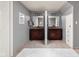 Bathroom features a dual vanity with granite counters and stylish lighting at 470 Mill Farm Rd, Noblesville, IN 46062