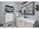Stylish bathroom with a modern vanity, framed mirror, and elegant fixtures at 470 Mill Farm Rd, Noblesville, IN 46062