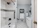 Bright bathroom with white tile, modern fixtures, and a decorative tile accent on the shower surround at 470 Mill Farm Rd, Noblesville, IN 46062