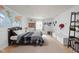 Spacious bedroom with neutral carpet, ample natural light, and a world map wall decor at 470 Mill Farm Rd, Noblesville, IN 46062