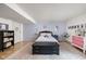 Cozy bedroom with decorative rug, black storage bench, and pink accents at 470 Mill Farm Rd, Noblesville, IN 46062