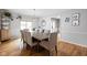 Elegant dining room with wood floors, chandelier, and seating for eight at 470 Mill Farm Rd, Noblesville, IN 46062