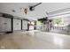 Spacious garage with epoxy floors, storage cabinets, and organization system at 470 Mill Farm Rd, Noblesville, IN 46062