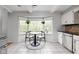 Breakfast nook with a round table and a view of the greenery outside at 470 Mill Farm Rd, Noblesville, IN 46062