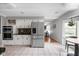 Bright kitchen with stainless steel refrigerator, white cabinets, and cozy breakfast nook at 470 Mill Farm Rd, Noblesville, IN 46062