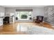 Bright living room with a cozy window seat and decorative floral wall art at 470 Mill Farm Rd, Noblesville, IN 46062