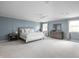Large main bedroom with plush carpeting, ensuite bathroom, and ample closet space at 470 Mill Farm Rd, Noblesville, IN 46062