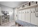 Mudroom featuring built-in bench seating, storage cubbies, coat hooks, and shoe storage at 470 Mill Farm Rd, Noblesville, IN 46062