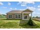 Exterior of home with covered patio and well-manicured lawn at 5032 Carmine St, Brownsburg, IN 46112
