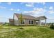 Exterior of home with a covered patio and large backyard at 5032 Carmine St, Brownsburg, IN 46112