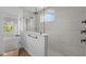 Modern bathroom featuring glass enclosed shower, a rainfall shower head, and sleek fixtures at 5032 Carmine St, Brownsburg, IN 46112