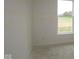 A bright bedroom with large windows offering views of the outdoors at 5032 Carmine St, Brownsburg, IN 46112