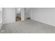 Comfortable bedroom with plush carpet and access to the bathroom at 5032 Carmine St, Brownsburg, IN 46112