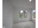A bright bedroom featuring natural light from the large windows at 5032 Carmine St, Brownsburg, IN 46112
