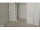 A bedroom featuring white walls and trim, with the door to the closet slightly ajar at 5032 Carmine St, Brownsburg, IN 46112
