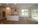 Spacious kitchen featuring ample sunlight, an island, and neutral tones at 5032 Carmine St, Brownsburg, IN 46112