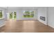 Open living space featuring a modern fireplace and access to the backyard at 5032 Carmine St, Brownsburg, IN 46112