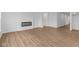 Open-concept living room featuring modern fireplace and light wood flooring at 5032 Carmine St, Brownsburg, IN 46112