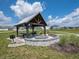 Community pavilion featuring picnic tables, grill, and fire pit, perfect for outdoor gatherings at 5203 Cartland Dr, Indianapolis, IN 46239