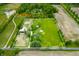 Aerial view of a 5.2 acre property in Trafalgar, Indiana featuring a pool and multiple homes at 5335 W 550 S, Trafalgar, IN 46181