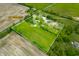Aerial view of a large 5.2 acre property in Trafalgar, Indiana with a pool at 5335 W 550 S, Trafalgar, IN 46181